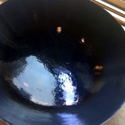 season new cast iron wok with fats